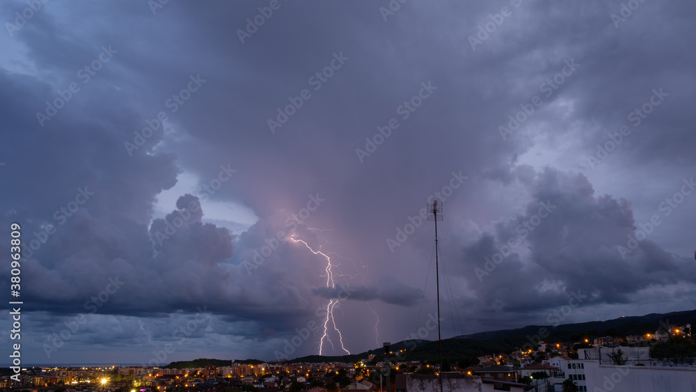 The lightning in the night sky over the city. The lightning in the night sky over the city.