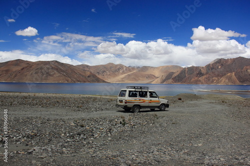 Pangong Tso, Pangong Lake, endorheic lake spanning eastern Ladakh and West Tibet, wetland with birds, mountain, blue sky and cloud around  © santosh