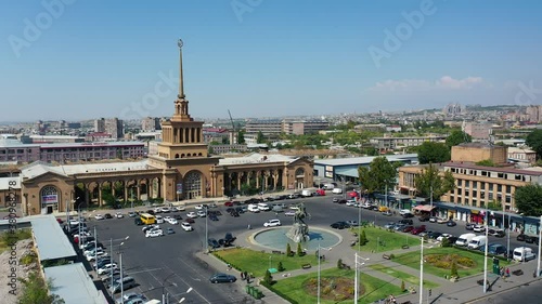 Aerial view the statue of David of Sasun near railway station. View on 
 Armenian flag from left. Park near statue. photo