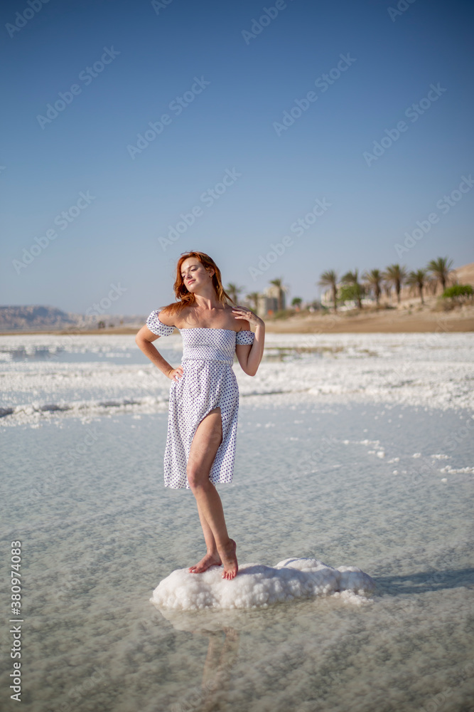 Young woman on Dead Sea, Israel. Ein Bokek