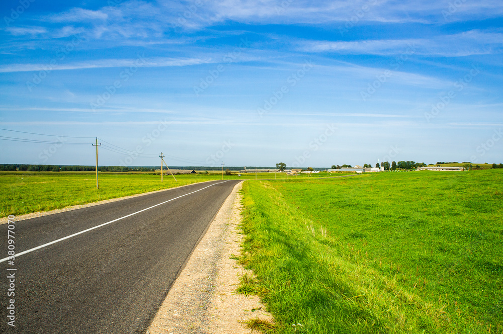 A beautiful automobile asphalt road without cars and people. A beautiful automobile asphalt road without cars and people.