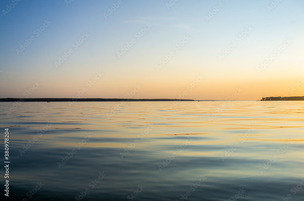 Beautiful lake landscape with sunset near the water