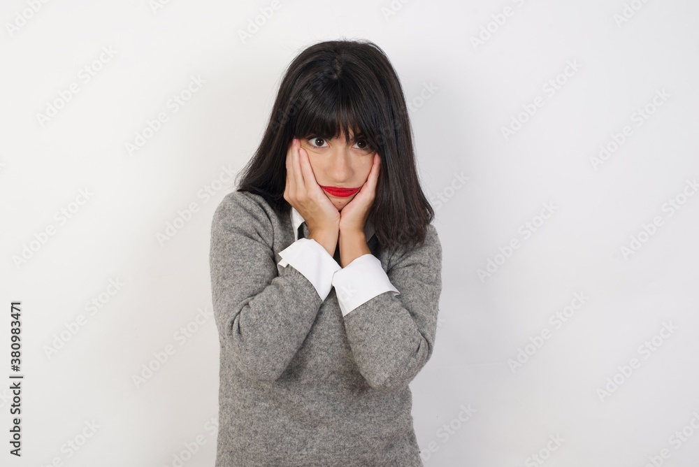 Young businesswoman with retro short hairdo wearing casual clothes standing over isolated white background Tired hands covering face, depression and sadness, upset and irritated for problem Young businesswoman with retro short hairdo wearing casual clothes standing over isolated white background Tired hands covering face, depression and sadness, upset and irritated for problem