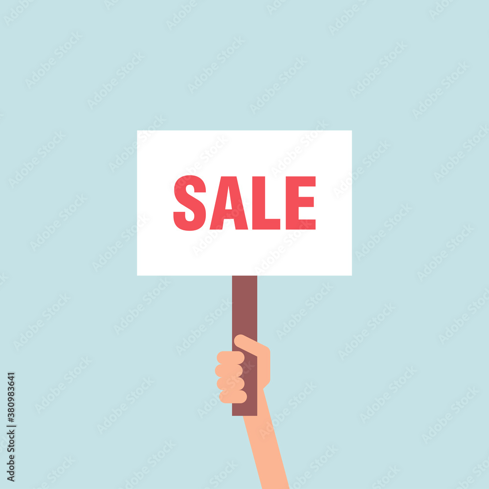 Hand Holding A Placard With Sale Sign Hand Holding A Placard With Sale Sign