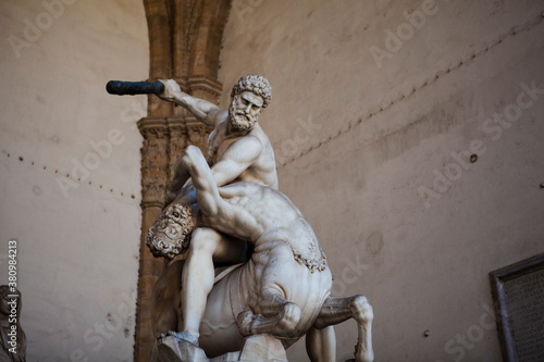 The marble sculptures of the fight of Hercules and the Centaur Nessus from Greek mythology in Florence, Tuscany, Italy. Stone muscular body statues of the demi-gods by Flemish sculptor Giambologna.