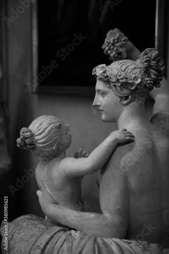 Close up. The white marble  Renaissance sculptures of a woman & a child created by the Italian artist Michelangelo at Galleria dell'Accademia. The art subjects in Florence, Tuscany, Italy. Europe.