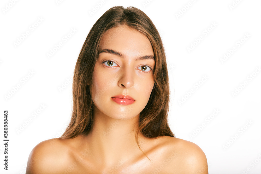 Close up portrait of beautiful young woman with perfect clean skin, nude makeup Close up portrait of beautiful young woman with perfect clean skin, nude makeup