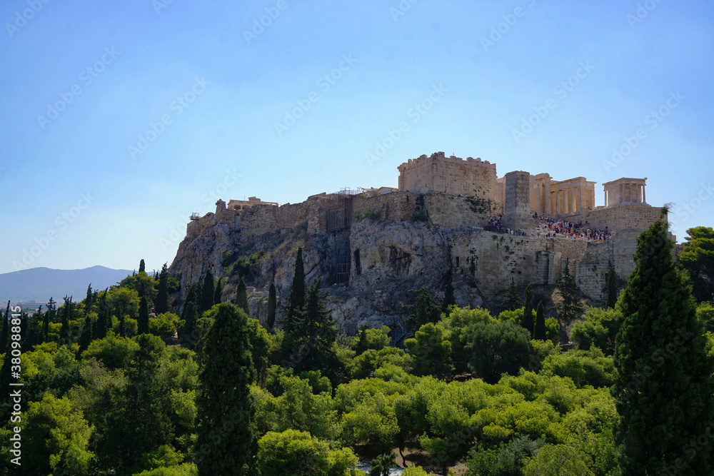 View towards the Acropolis through a wooded area
