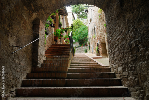 Steep hillside steps in a tunnel alleyway in Assisi Italy