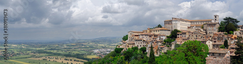 Panorama of hilltop city of Todi Italy with Tiber valley farm fields and Pontecuti