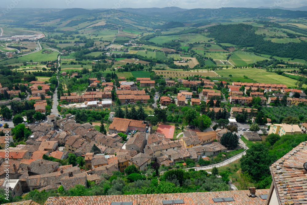 View of rooftops and pastureland hills from San Fortunato church in Todi Italy