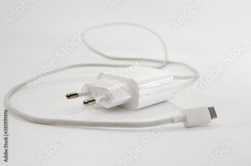 white charger for a smartphone on a white background.