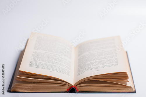 Photo of an open book on a white background.