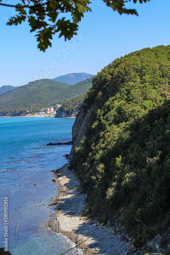 view of the sea, rocks and forest from the hill