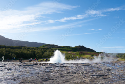 Stokkur geyser eruption  Iceland. Blue sky in a sunny day  Landscape view. Geysir