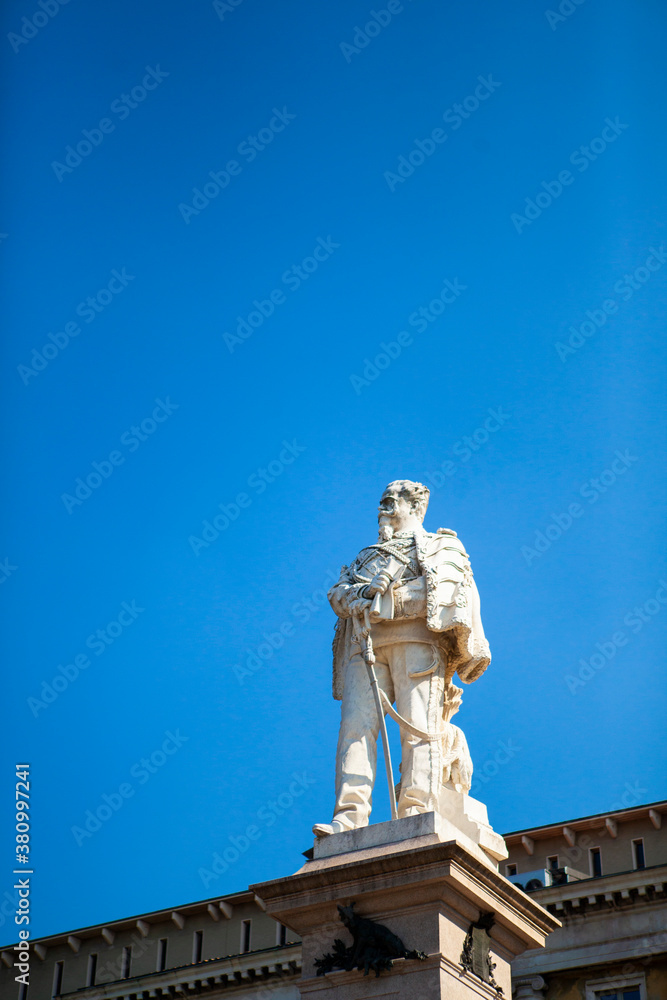 Fototapeta premium The monument of Vittorio Emanuele II in Bergamo, Lombardy, Italy. The statue is made of white marble in the Lower City (Città Bassa) in front of the city hall. European architecture.