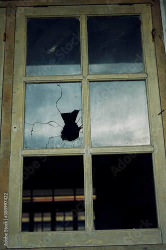 Bullet hole in the window, crime scene evidence concept