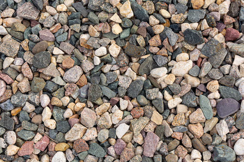 Naklejka premium Granite gravel. Background and texture of stones for project and design.