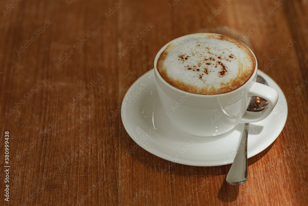 Coffee cup the wood table by the window with the bright light of the morning sun in the cafe shop, Cozy atmosphere is for relaxing on vacation or charge energy to refresh the body and ready to work. Coffee cup the wood table by the window with the bright light of the morning sun in the cafe shop, Cozy atmosphere is for relaxing on vacation or charge energy to refresh the body and ready to work.