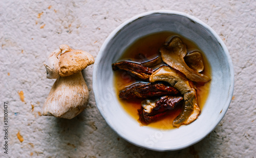 Fresh and dried porcini mushrooms on the table Healthy vegan food 
