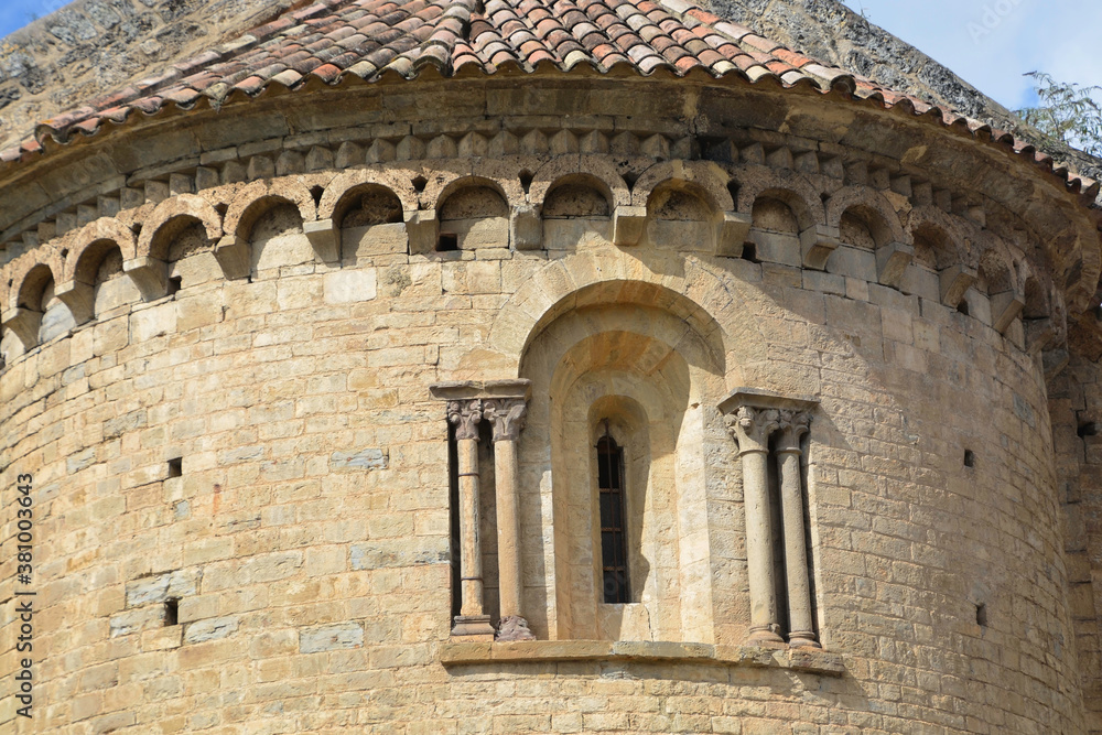 BEGET, CATALONIA, SPAIN, EUROPE, SEPTEMBER 2020 Window with columns on both sides and an upper arcade of the Romanesque church of San Cristóbal in the beautiful medieval town of Beget.