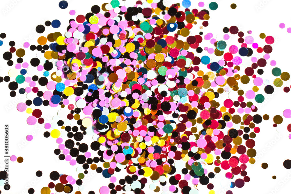Many multicolored metallic circles forming a texture for the background.