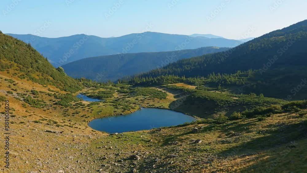 Lake Vorozheska on a sunny day, Carpathians, Ukraine Lake Vorozheska on a sunny day, Carpathians, Ukraine