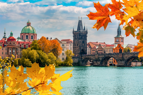 Prague cityscape and Charles bridge over Vltava river in autumn, Czech Republic