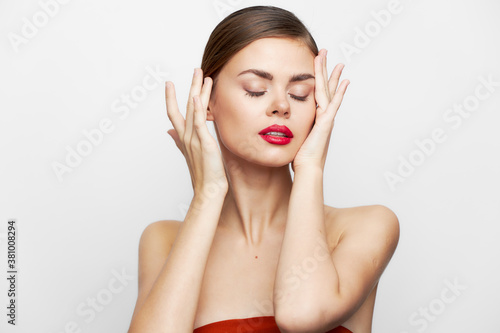 Woman with bare shoulders Eyes closed Skin care makeup 