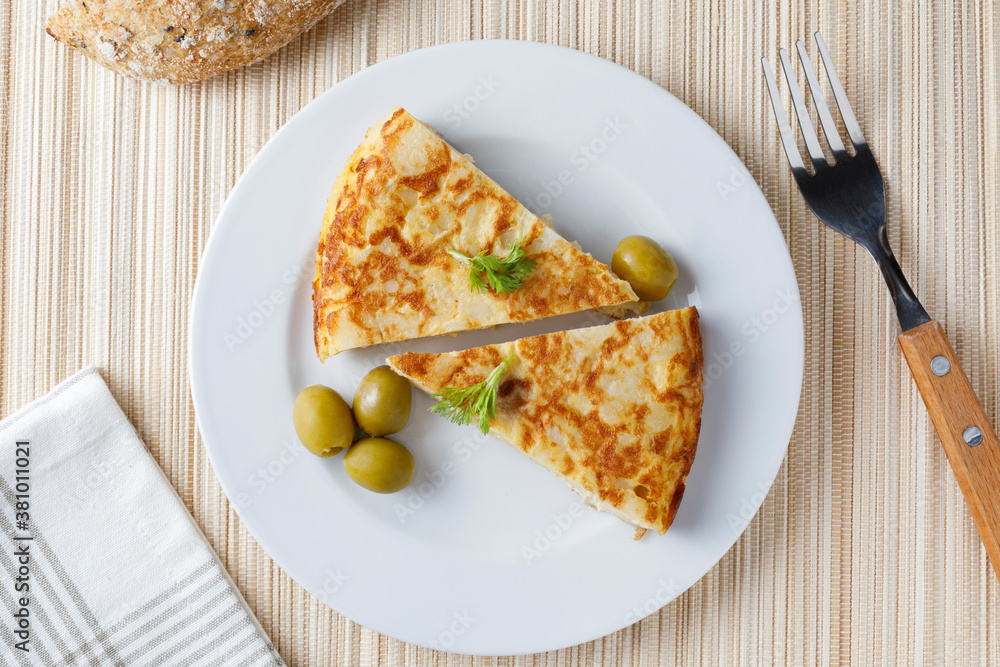Tradiotional spanish omelette with parsley Tradiotional spanish omelette with parsley