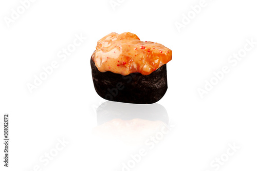 Sushi. Baked roll with fish, salmon, rice, avocado and cheese. Sushi with a reflection on a white background. Chinese sea food.