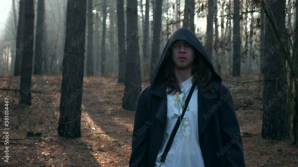 Wanderer in Black Cloak Cowl Walks Through Misty Forest. Wandering Monk Pilgrim. Autumn Morning. Mysterious Traveler. 2x Slow motion 60 fps 4K Wanderer in Black Cloak Cowl Walks Through Misty Forest. Wandering Monk Pilgrim. Autumn Morning. Mysterious Traveler. 2x Slow motion 60 fps 4K
