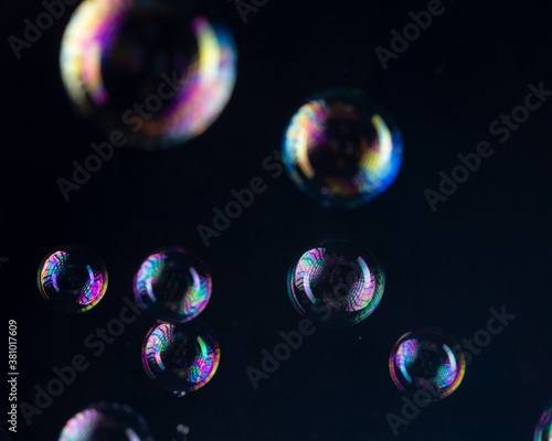 Rainbow bubbles on a black background