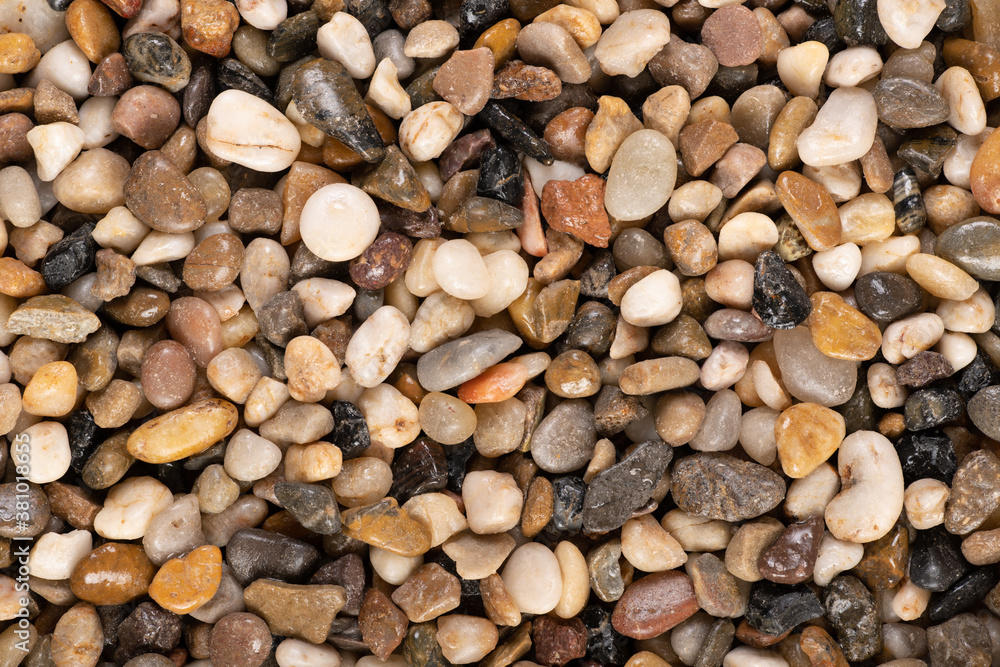 Multi-colored small river stones texture and background. Multi-colored small river stones texture and background.