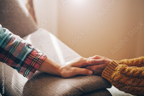 Obraz na plátně Close up view of upset couple, guy holding hands of crying woman, trying to comfort and console her, boyfriend apologizing offended lady, asking for forgiveness