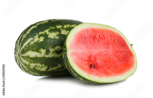 Delicious whole and cut watermelons isolated on white