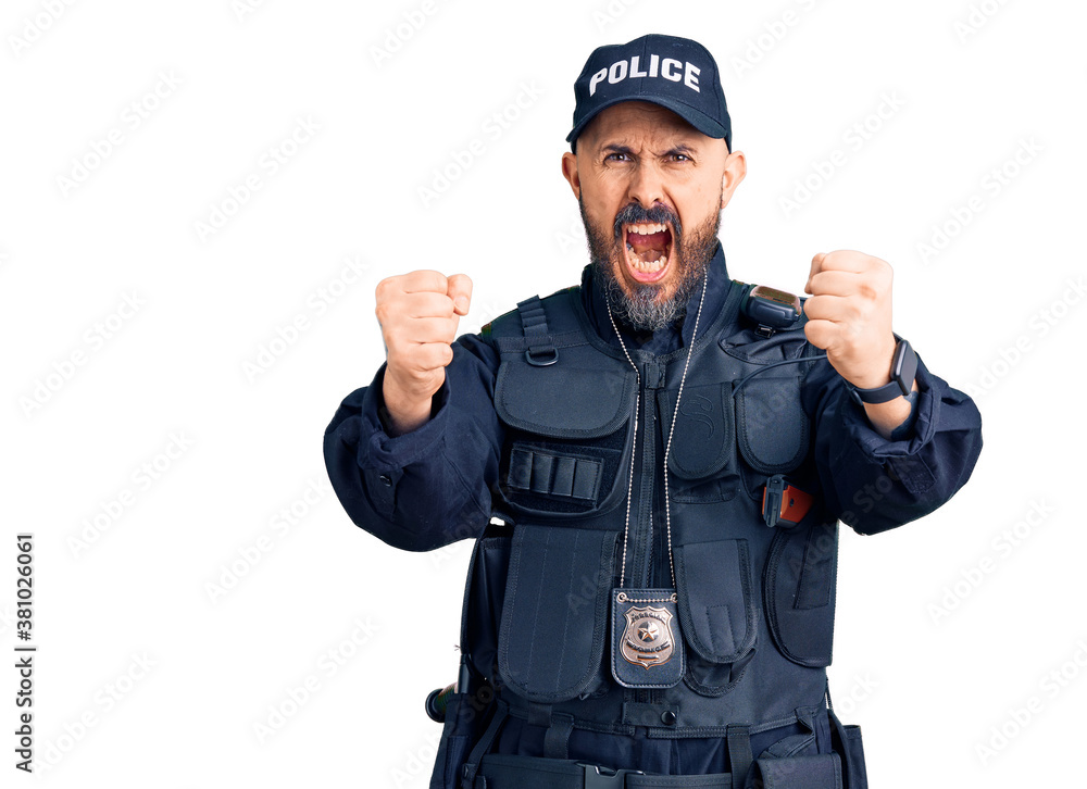 Young handsome man wearing police uniform angry and mad raising fists frustrated and furious while shouting with anger. rage and aggressive concept. Young handsome man wearing police uniform angry and mad raising fists frustrated and furious while shouting with anger. rage and aggressive concept.