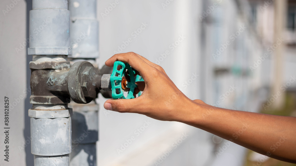 Open green water valve outdoor. Open green water valve outdoor.