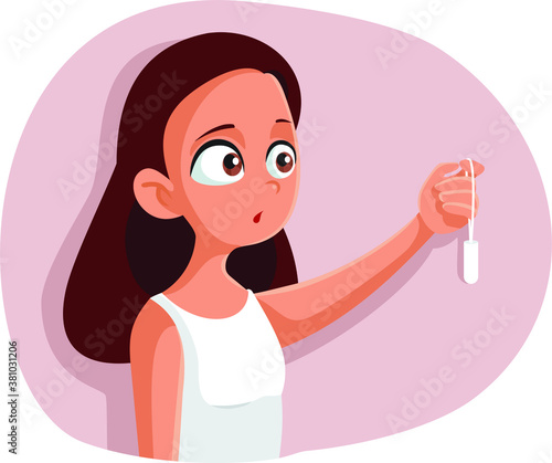Teen Girl Experiencing First Menstruation Holding a Tampon