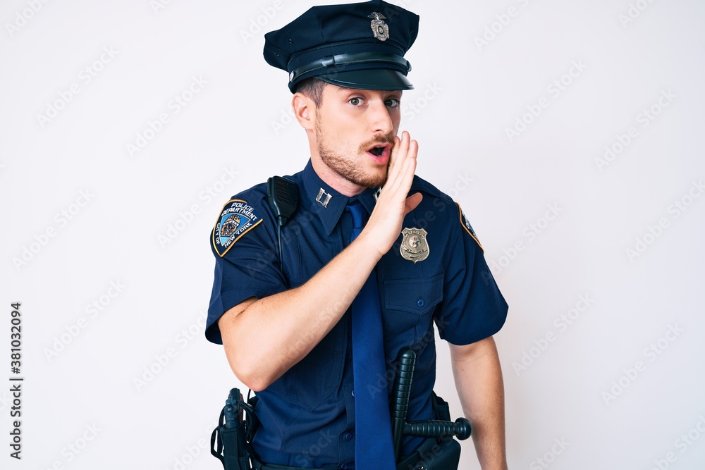 Young caucasian man wearing police uniform hand on mouth telling secret rumor, whispering malicious talk conversation Young caucasian man wearing police uniform hand on mouth telling secret rumor, whispering malicious talk conversation