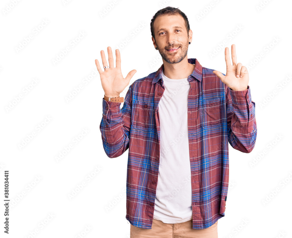 Young handsome man wearing casual clothes showing and pointing up with fingers number eight while smiling confident and happy. Young handsome man wearing casual clothes showing and pointing up with fingers number eight while smiling confident and happy.