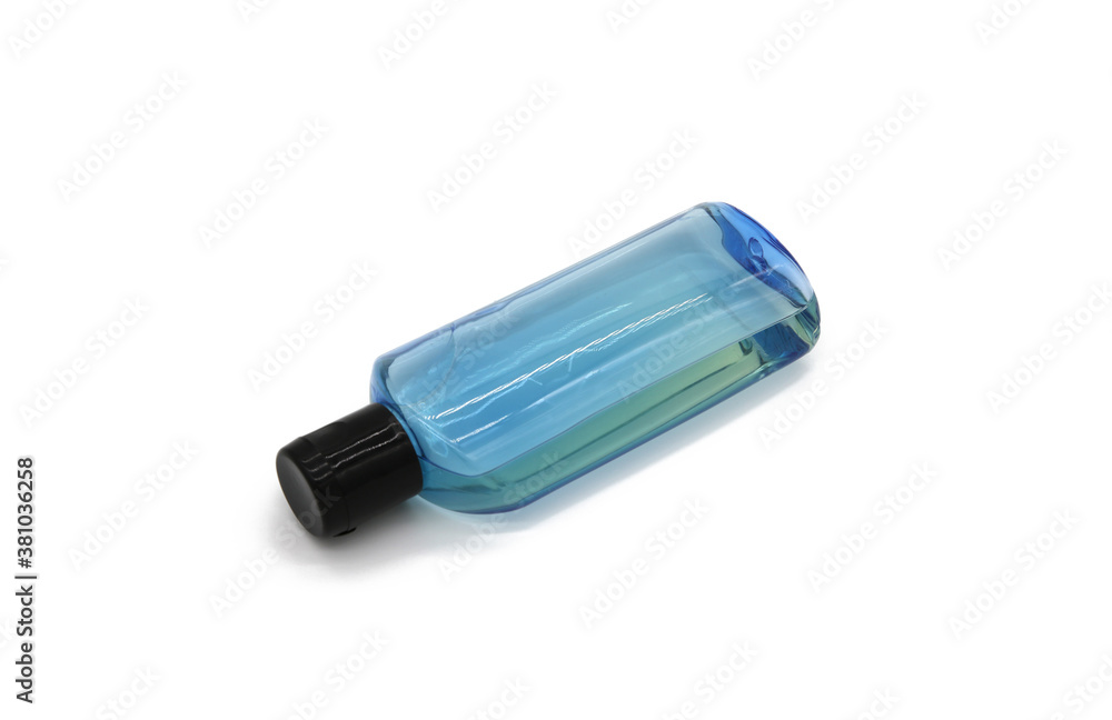 Blue bottle with transparent liquid on white background plate Blue bottle with transparent liquid on white background plate