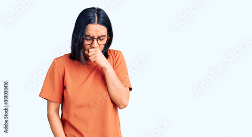 Young beautiful latin woman wearing casual clothes feeling unwell and coughing as symptom for cold or bronchitis. health care concept.