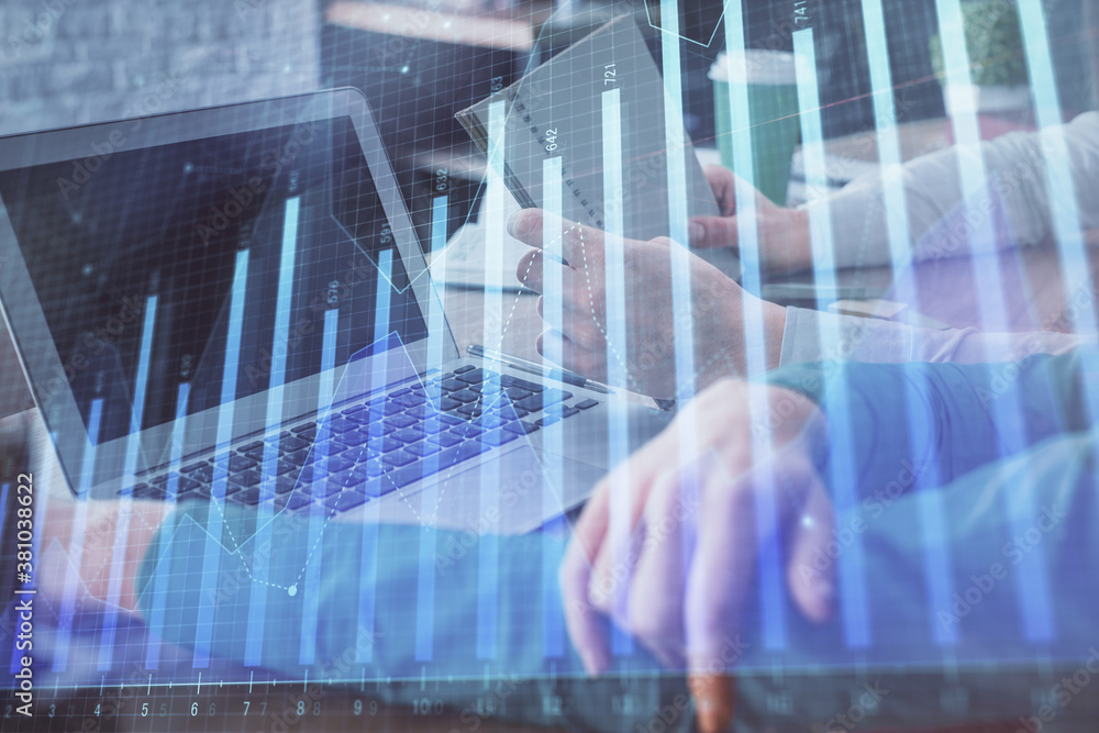 Double exposure of man and woman working together and forex chart hologram. Business concept. Computer background. Double exposure of man and woman working together and forex chart hologram. Business concept. Computer background.