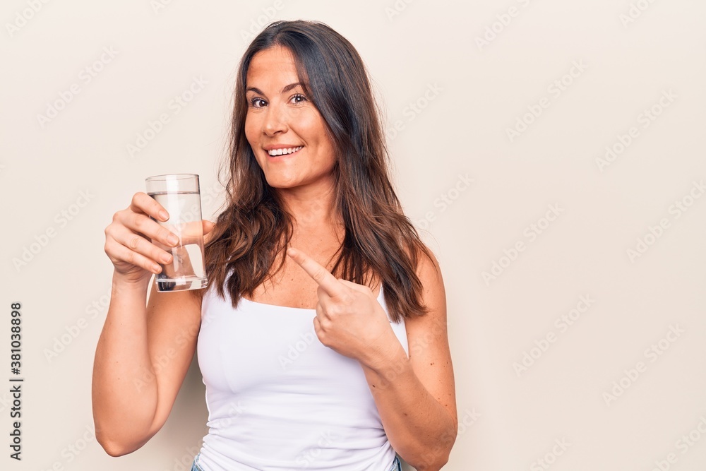 Young beautiful brunette woman wearing casual t-shirt standing over isolated white background suffering from headache desperate and stressed because pain and migraine. Hands on head. Young beautiful brunette woman wearing casual t-shirt standing over isolated white background suffering from headache desperate and stressed because pain and migraine. Hands on head.