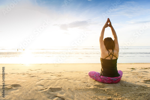 Woman yoga on the beach