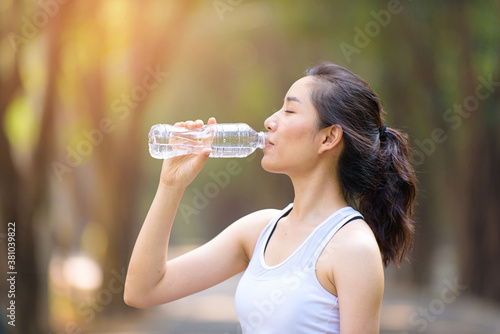 Young Asian woman and a bottle of water