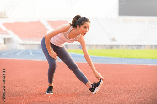 Young woman do stretch before sport