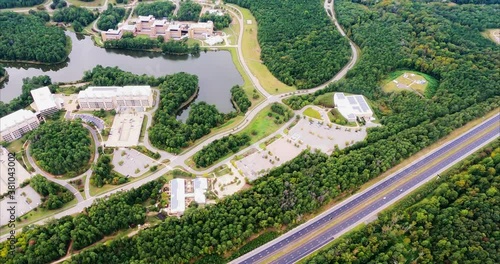 Flight over Research Triangle Park in Durham, NC shows National Institute of Environmental Health Sciences, Environmental Protection Agency, and US EPA National Computer Center beside Discovery Lake n photo