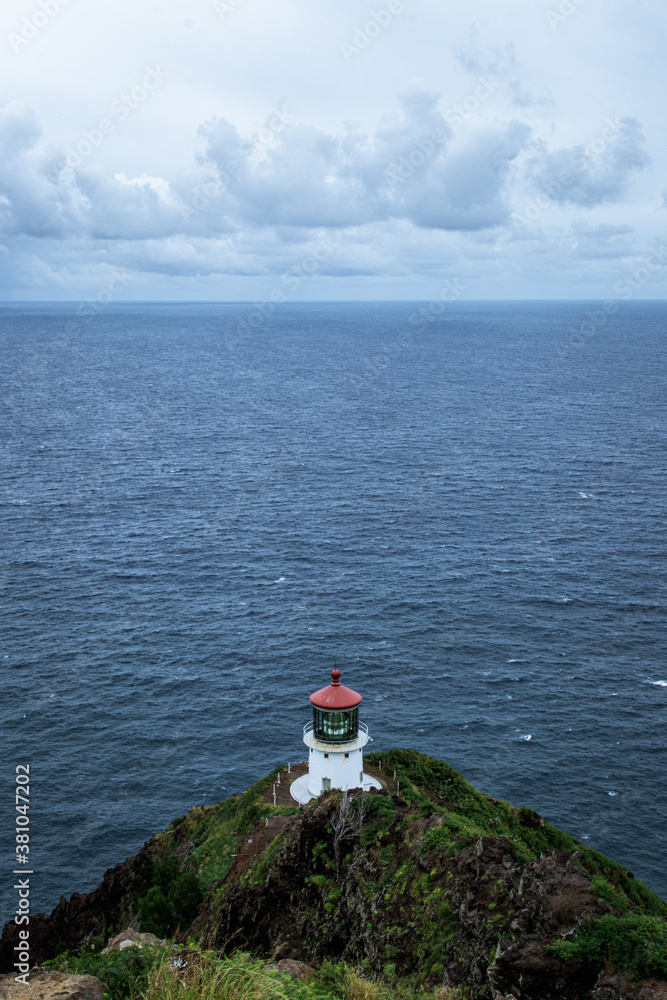 Lighthouse landscape shot in Hawaii with ocean background